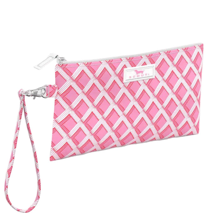 Pink and white patterned wristlet with a strap on a light white background. Available at Be Charmed