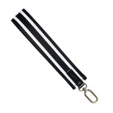 Black and white striped lanyard with a metal clip on a white background. Available at Be Charmed