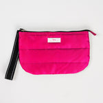 Pink Puffer SCOUT Roamy Wristlet – quilted soft pouch (9.5″ W × 6″ H × 1.25″ D) with attached wristlet strap. Lightweight and secure. Available at Be Charmed