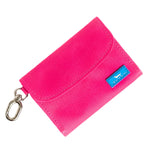 Pink wallet with a blue tag on a white background. Available at Be Charmed