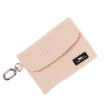 A tan ribbed fabric Scout card holder pouch with a silver metal clasp and a small black brand tag, shown on a clean white background. Available at Be Charmed