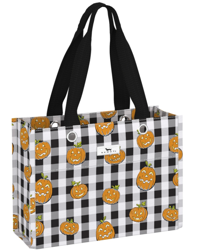 A tote bag with a black and white buffalo check pattern and an all-over print of orange jack-o'-lantern pumpkins. It features two black shoulder straps and a small white brand label on the front. Available at Be Charmed