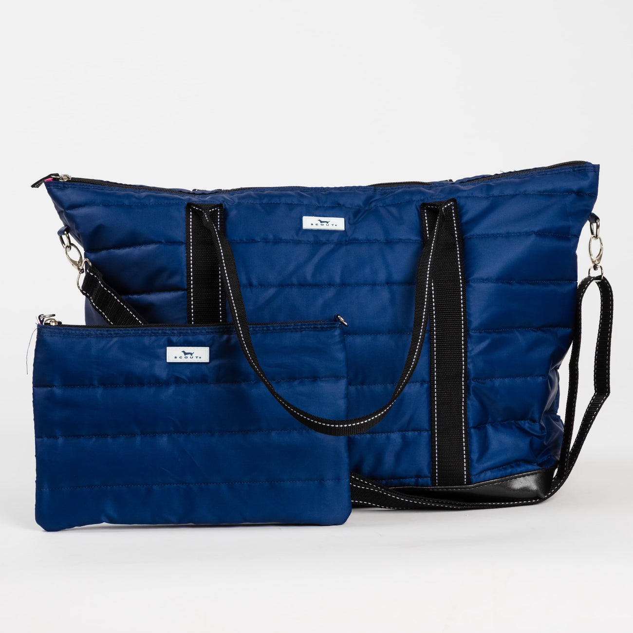 Navy Puffer  SCOUT Triple Advisor Travel Bag – quilted puffer 3‑in‑1 tote, removable pouch & crossbody strap. Trolley sleeve and lightweight design. Available at Be Charmed