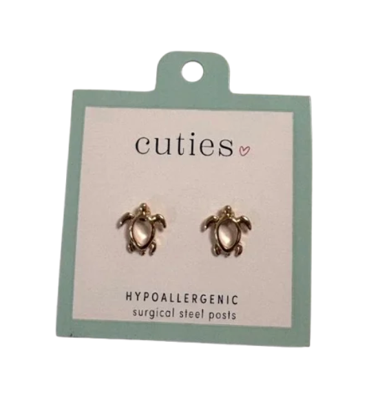 A pair of turtle-shaped stud earrings on a mint green and white card labeled 'cuties hypoallergenic surgical steel posts'. Available at Be Charmed