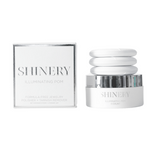 Shinery Illuminating Pom packaging with a jar on a white background. Available at Be Charmed
