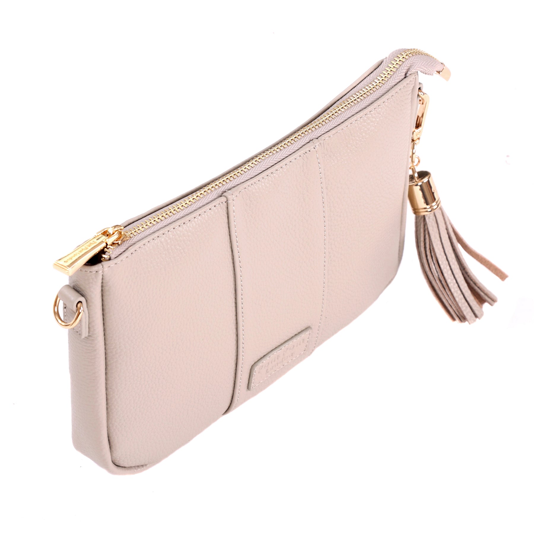 Side view of Pom Pom London City Slim Bag – handcrafted leather crossbody with sleek design and adjustable strap. Designed in London. Available at Be Charmed.