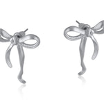 Silver Big Metal London Matte Paloma Bow stud earrings in matte gold or silver finish, recycled brass and surgical‑steel posts, hypoallergenic – Available at Be Charmed