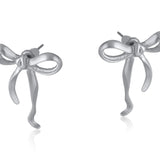Silver Big Metal London Matte Paloma Bow stud earrings in matte gold or silver finish, recycled brass and surgical‑steel posts, hypoallergenic – Available at Be Charmed