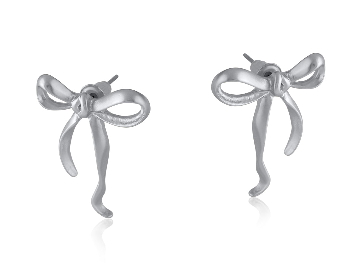 Silver Big Metal London Matte Paloma Bow stud earrings in matte gold or silver finish, recycled brass and surgical‑steel posts, hypoallergenic – Available at Be Charmed
