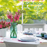 Cookbook cover titled 'The Newlywed's Cookbook' with a table setting and flowers. Available at Be Charmed