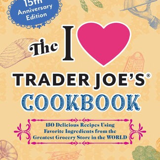 Cover of 'The I Love Trader Joe's Cookbook' with heart graphic and text on a beige background. Available at Be Charmed.  