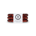 Small Tortoise Teleties Hair Ties—strong grip, waterproof, no crease—available at Be Charmed.