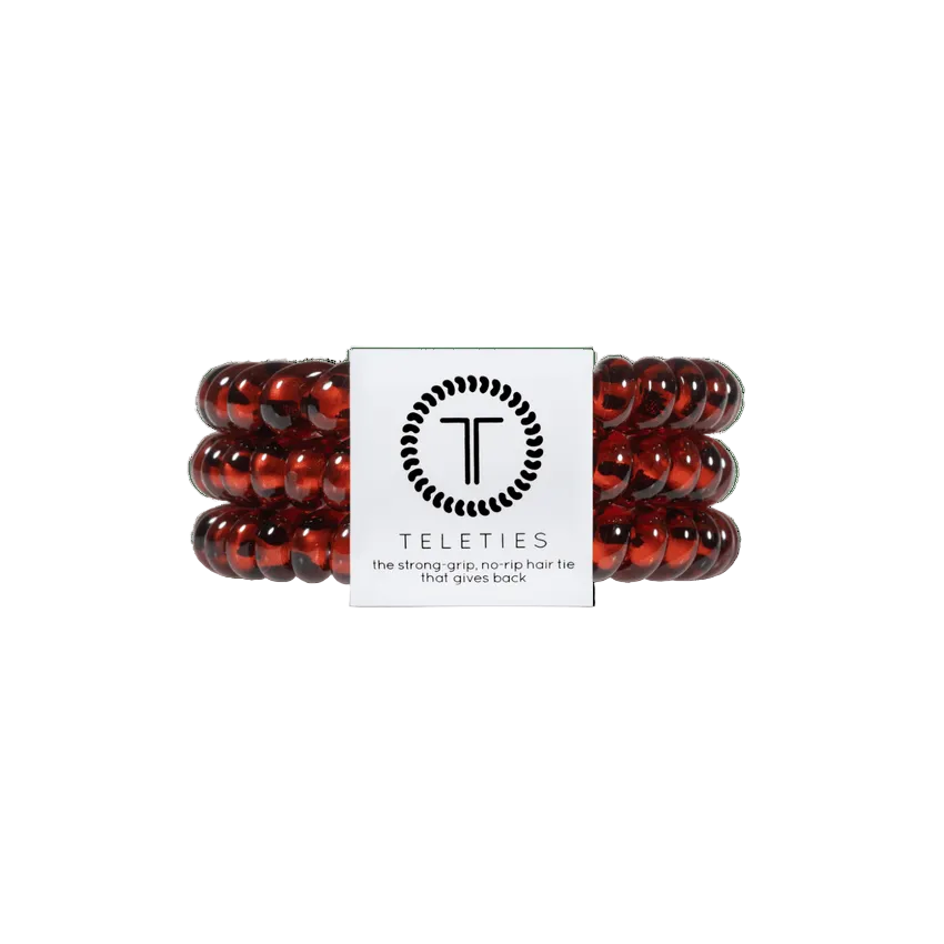 Small Tortoise Teleties Hair Ties—strong grip, waterproof, no crease—available at Be Charmed.