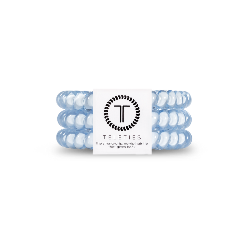 A pack of three small washed denim hair ties with the brand logo 'T' on the packaging, indicating the product is from Teleties. Available at Be Charmed