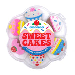 Set of cupcake-shaped scented erasers in a clear plastic container with 'Scenty Sweet Cakes' branding. Available at Be Charmed. 