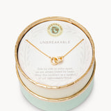 Gold in box Spartina 449 Unbreakable Necklace 18 Inch – Features two interlocking rings symbolizing enduring strength and connection. A delicate 18" chain with secure clasp supports this elegant and meaningful charm design. Perfect gift for loved ones. Available at Be Charmed.
