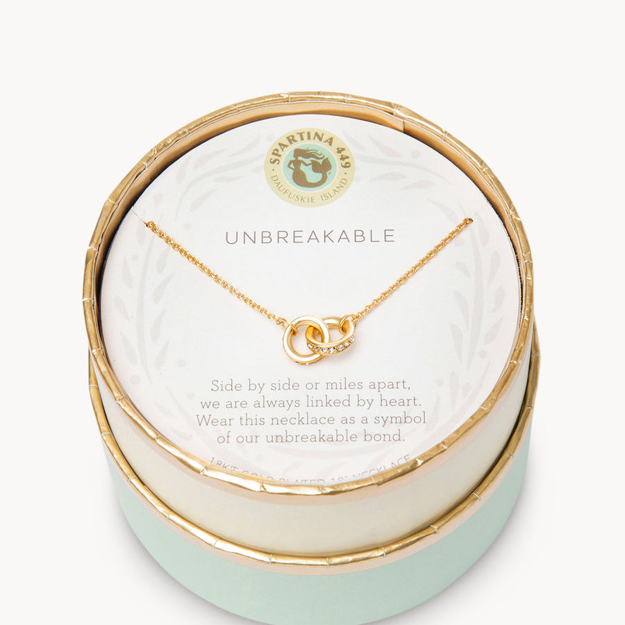 Gold in box Spartina 449 Unbreakable Necklace 18 Inch – Features two interlocking rings symbolizing enduring strength and connection. A delicate 18" chain with secure clasp supports this elegant and meaningful charm design. Perfect gift for loved ones. Available at Be Charmed.