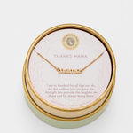 Gold 'mama' necklace in a round box with a message card on a light gray background. Available at Be Chamred