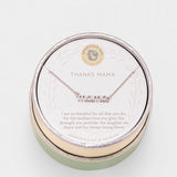 Necklace with 'THANKS MAMA' pendant in a round green box on a light gray background. Available at Be Charmed