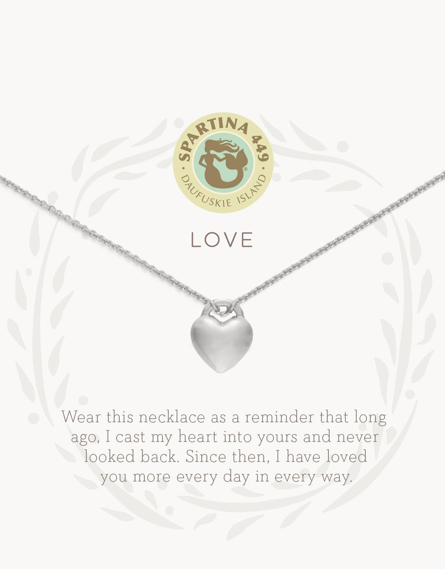 Silver on card Spartina 449 Love Necklace 18 Inch – Elegant heart charm necklace engraved with “Love.” A classic and meaningful gift for someone special. Features a delicate 18" chain, secure clasp, and polished finish, ideal for daily wear or special occasions. Available at Be Charmed.