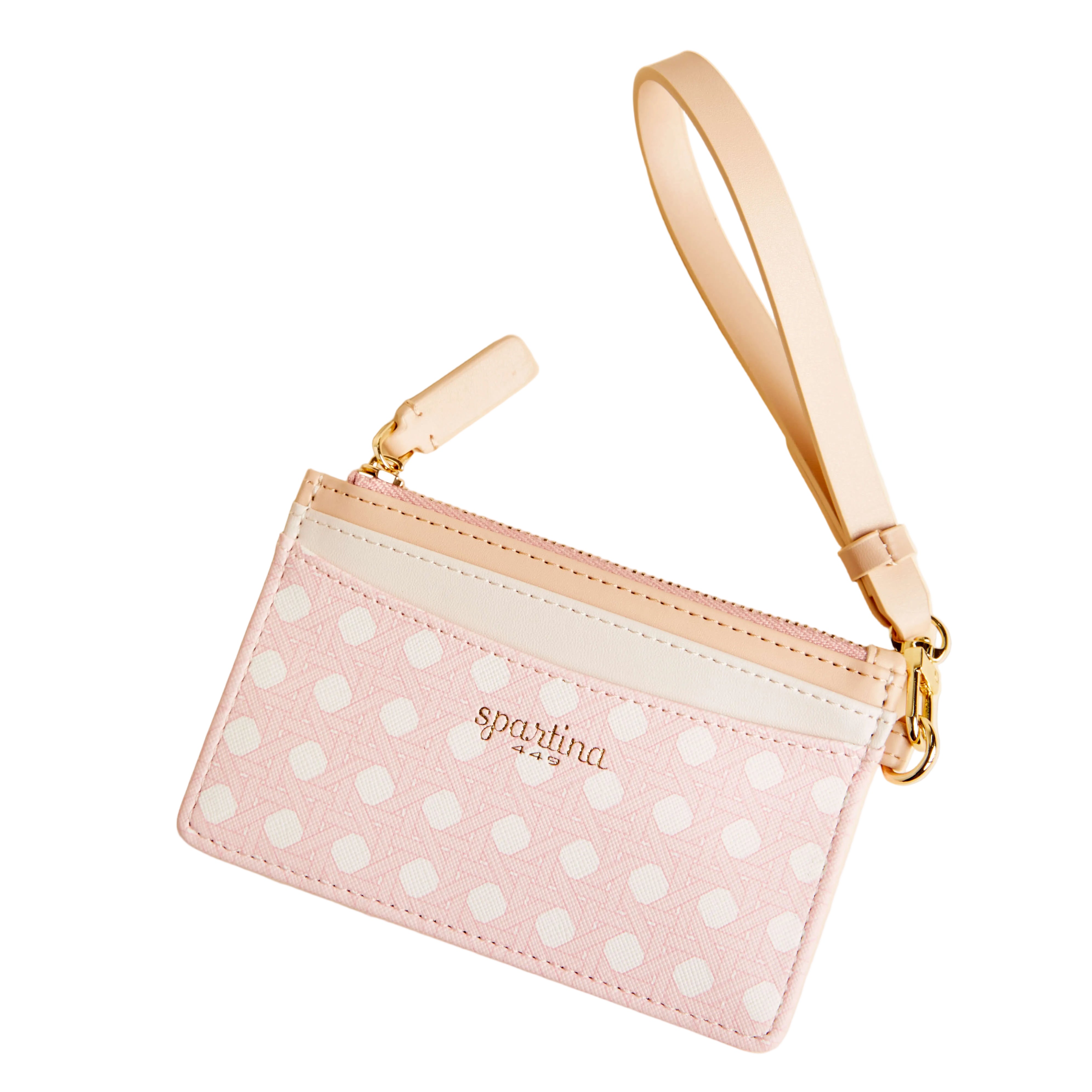 Pink polka dot pouch with gold strap on a beige background. Available at Be Charmed