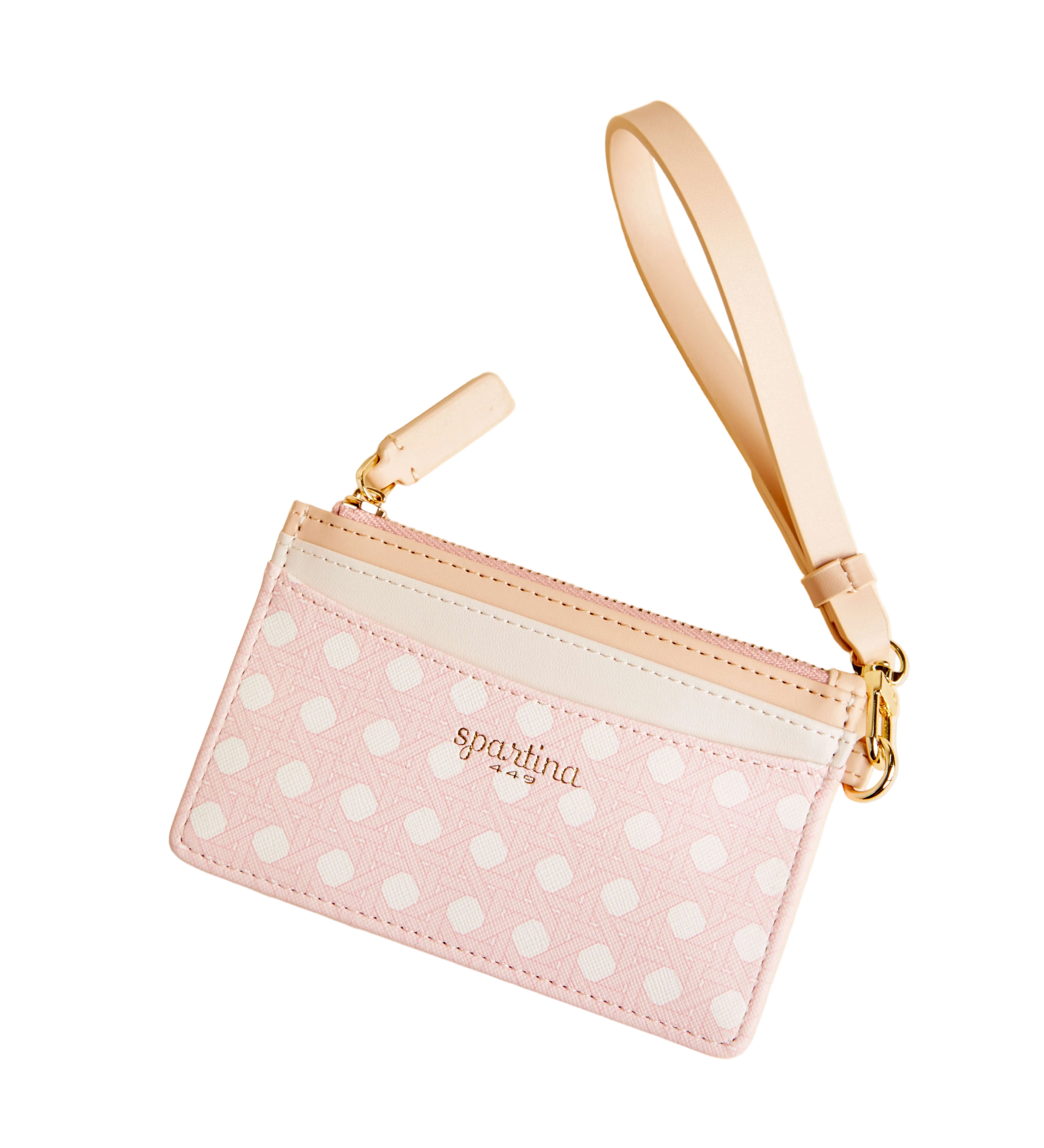 Pink polka dot pouch with gold strap on a beige background. Available at Be Charmed