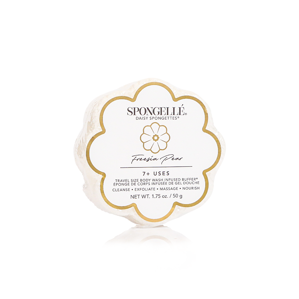 A packaged bar of Spongellé Freesia Pear body wash with the brand's logo and product details on the label. Available at Be Charmed