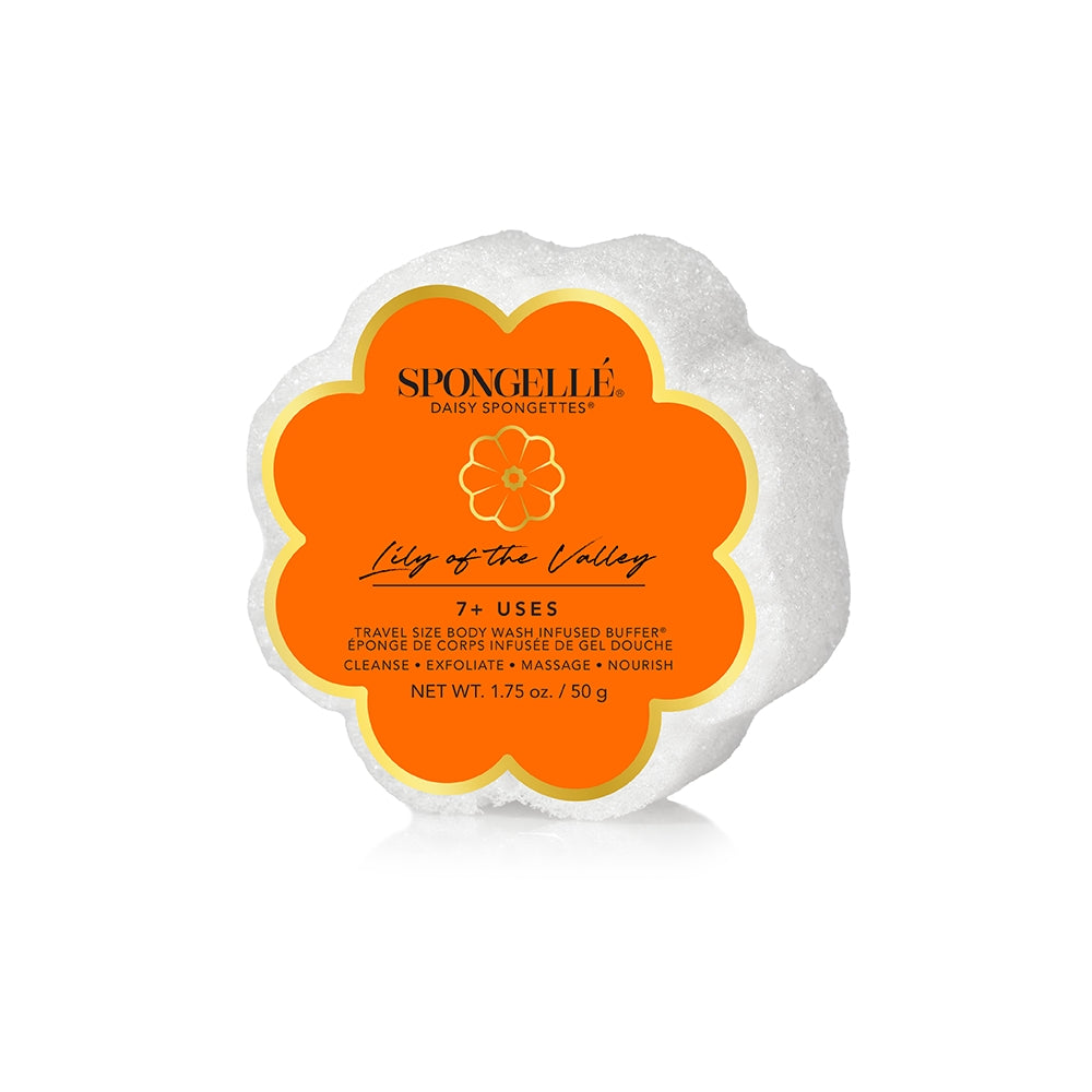 A Spongellé bath sponge from the Daisy Collection with a floral design, predominantly white with an orange label. Available at Be Charmed