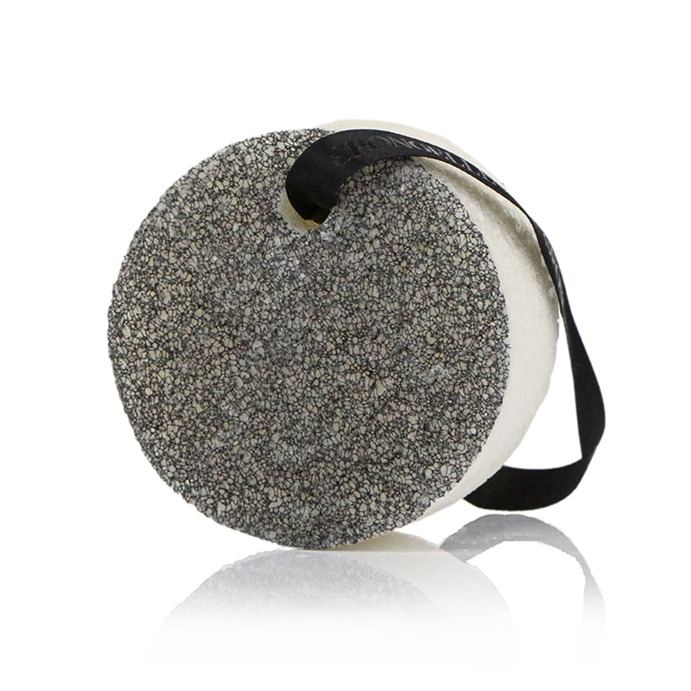 Close up of Spongellé Men’s Supreme Buffer in Black Scrubber, a 20+ use infused body scrubber. Available at Be Charmed