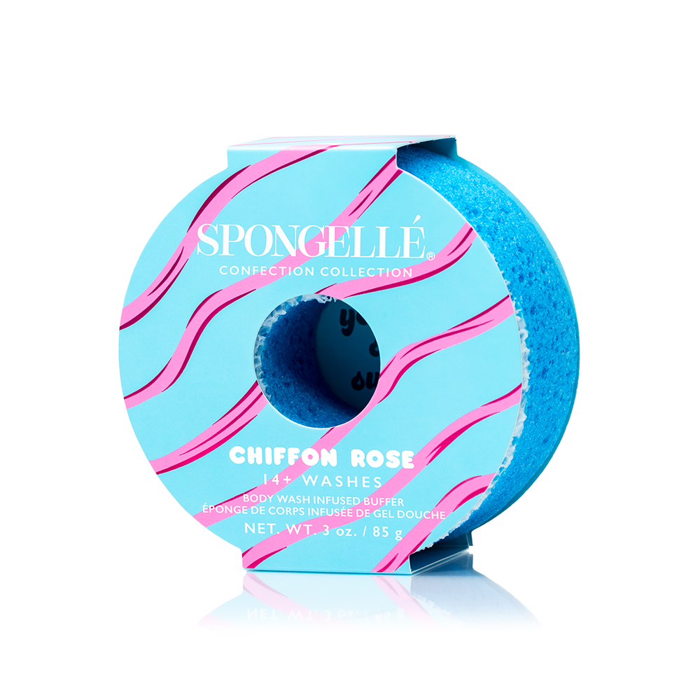 A blue donut-shaped buffer with pink stripes labeled 'Spongelle' and 'Chiffon Rose' with additional text indicating the scent and number of washes. Available at Be Charmed
