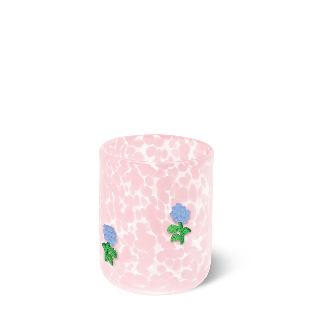 Pink glass with blue floral designs on a white background. Available at Be Charmed