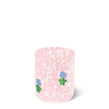 Pink glass with blue floral designs on a white background. Available at Be Charmed