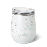 A 12oz white insulated stemless wine cup with multicolor pattern and the brand 'Swig' visible. Available at Be Charmed