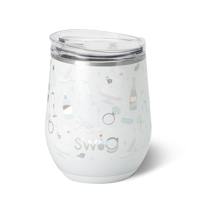 A 12oz white insulated stemless wine cup with multicolor pattern and the brand 'Swig' visible. Available at Be Charmed