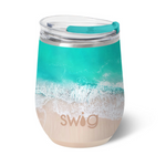 A 12oz Swig brand insulated stemless wine cup with a beach and ocean design. Available at Be Charmed