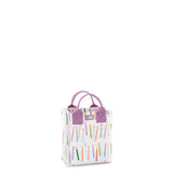 A mini reusable gift bag with a multicolored geometric pattern and purple handles. Available at Be Charmed