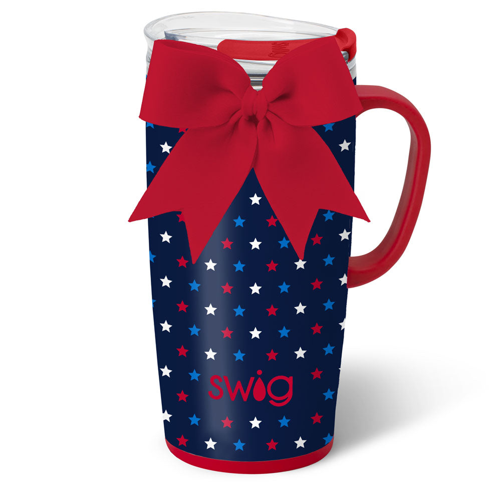 Blue mug with red, white, and blue star pattern and red handle, featuring a red bow on a white background. Available at Be Charmed