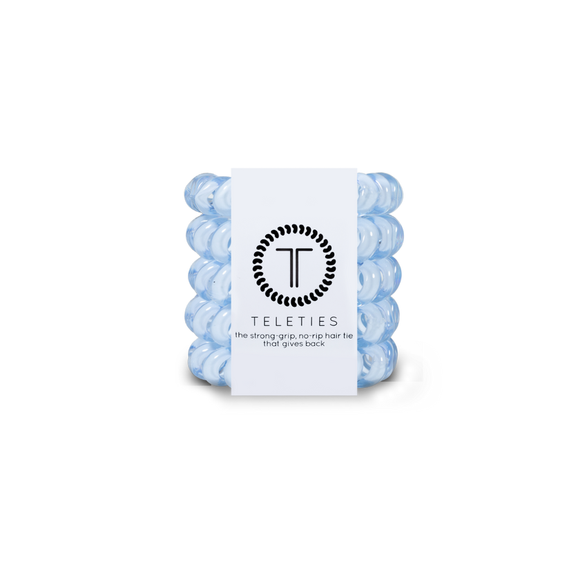 A pack of three tiny washed denim hair ties with the brand logo 'T' on the packaging, indicating the product is from Teleties. Available at Be Charmed