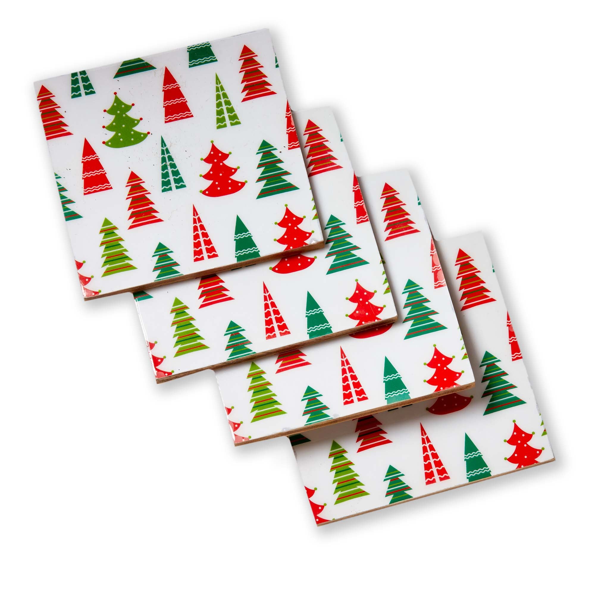 Set of four ceramic coasters with Christmas tree pattern on a white background.  Available at Be Charmed