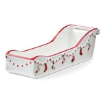 A festive ceramic sleigh-shaped cracker dish from the Holiday Cheer collection, available at Be Charmed.