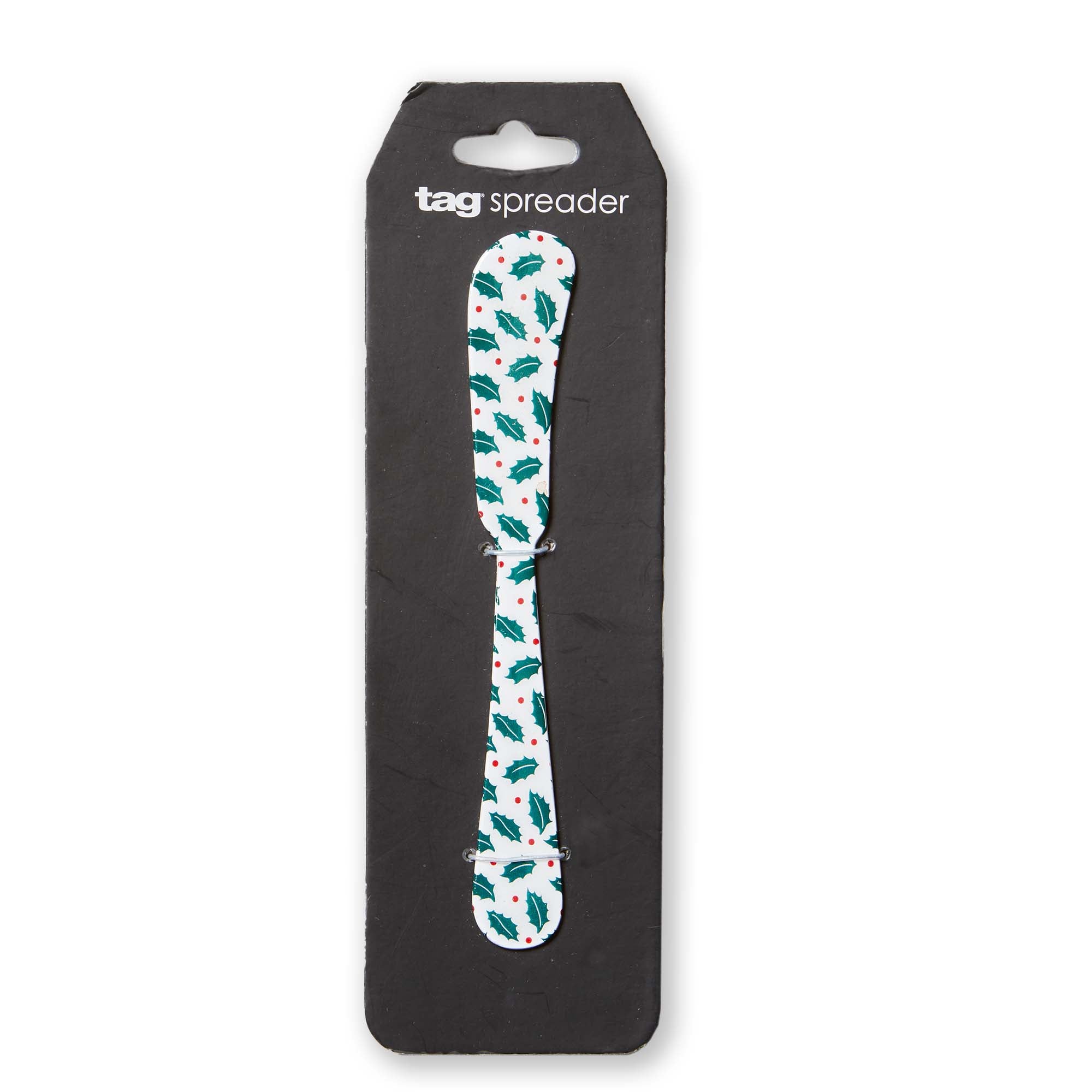 Spreader with holly design in packaging on a white background. Available at Be Charmed