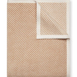 Tan Chappy Wrap Harborview Herringbone Blanket – Original size throw in a classic light grey herringbone pattern. Plush, durable, and machine washable. A cozy neutral accent for the home or perfect gift. Available at Be Charmed.