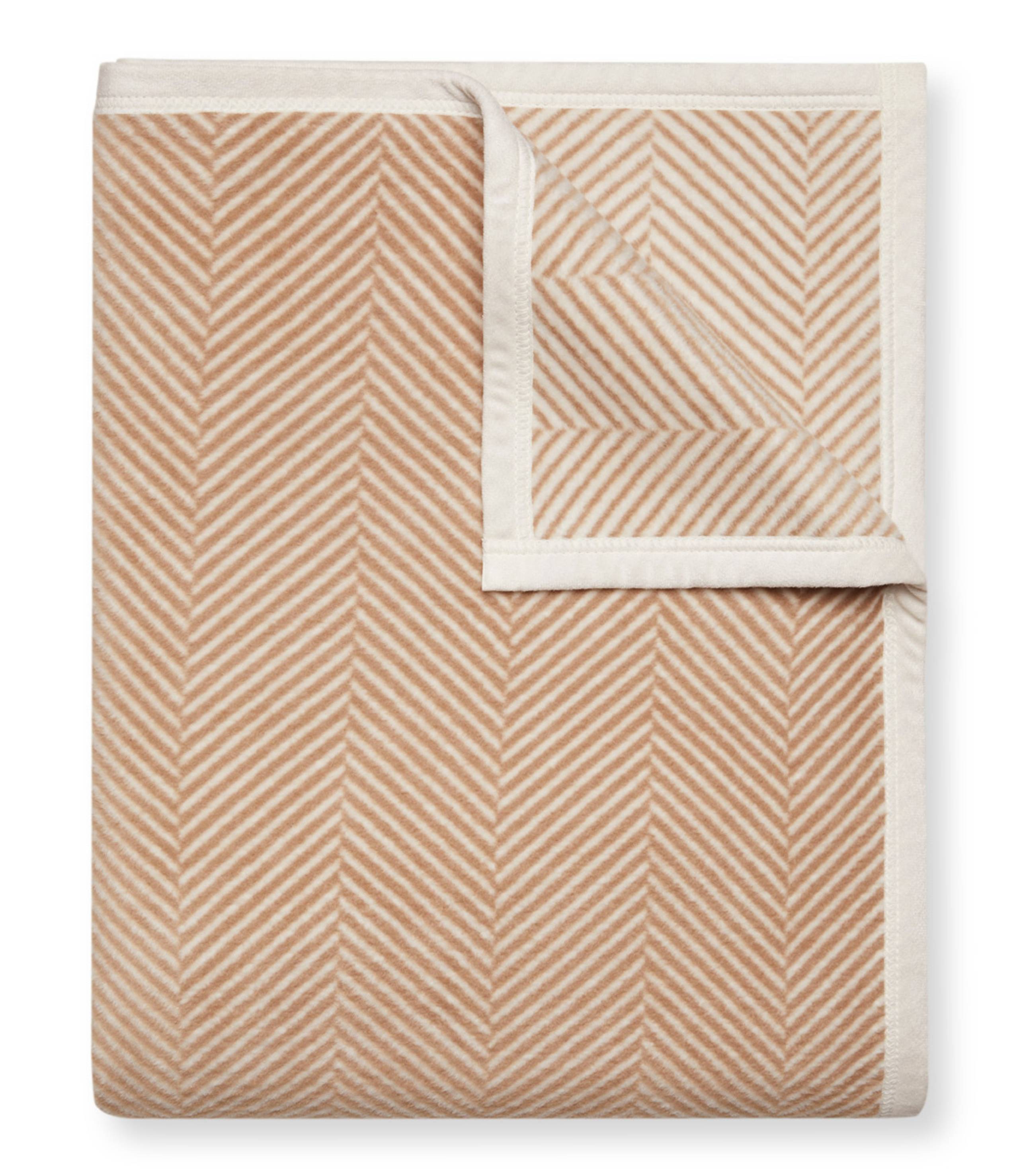 Tan Chappy Wrap Harborview Herringbone Blanket – Original size throw in a classic light grey herringbone pattern. Plush, durable, and machine washable. A cozy neutral accent for the home or perfect gift. Available at Be Charmed.