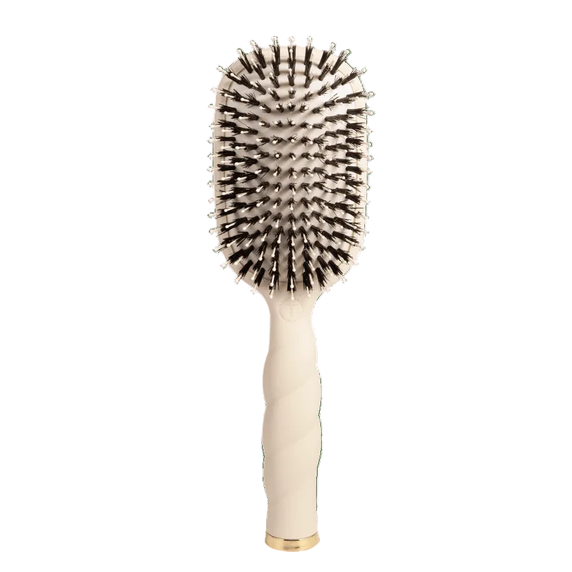 Tan Teleties hairbrush with boar bristle head on a white background. Available at Be Charmed
