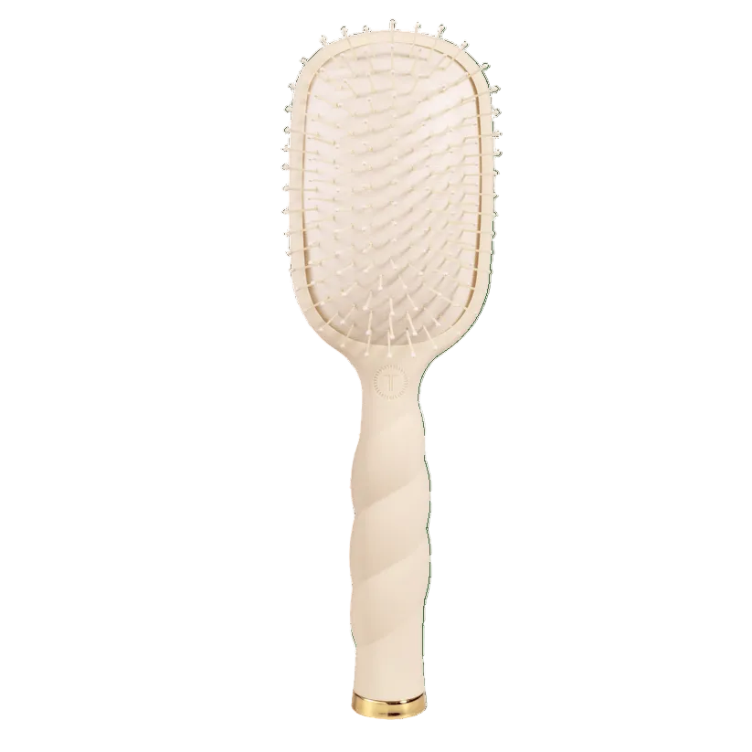 Tan TeletiesDetangler hairbrush for medium hair with gold accents on a transparent background. Available at Be Charmed