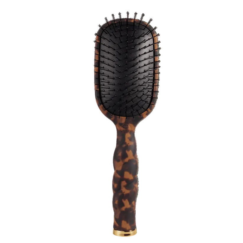Tortoise TeletiesDetangler hairbrush for medium hair with gold accents on a transparent background. Available at Be Charmed