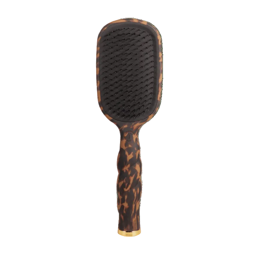 TortoiseTeleties Detangler paddle hairbrush for thick hair with gold accents on a transparent background. Available at Be Charmed