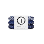 Set of large  Nightfall Navy hair ties with a Teleties branded label on a white background. Available at Be Charmed