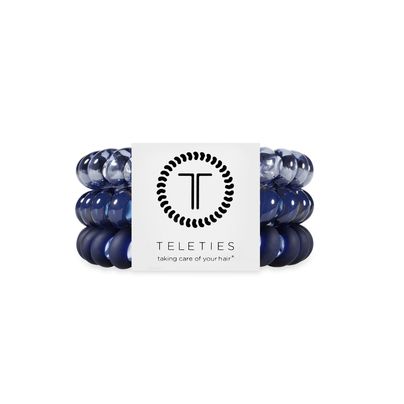 Set of large  Nightfall Navy hair ties with a Teleties branded label on a white background. Available at Be Charmed