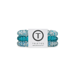 Set of Soft Surf hair ties with a Teleties branded card on a white background. Available at Be Charmed